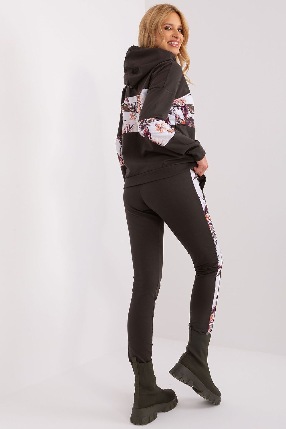 Chic high-rise pants with floral fabric accents and a comfortable fit, part of the floral insert tracksuit set by Relevance for women.