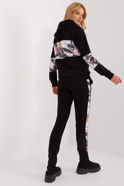 Casual yet stylish women’s tracksuit set by Relevance, featuring a comfortable hoodie with floral inserts and high-rise pants, ideal for modern elegance.