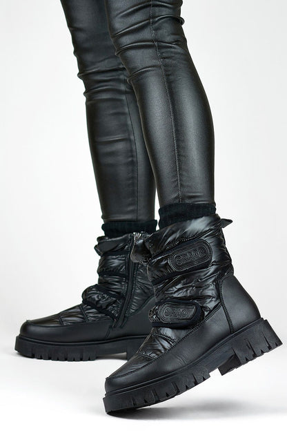 Elegant PRIMO Eco Leather Snow Boots showcasing a modern round toe and practical zipper closure for effortless style.
