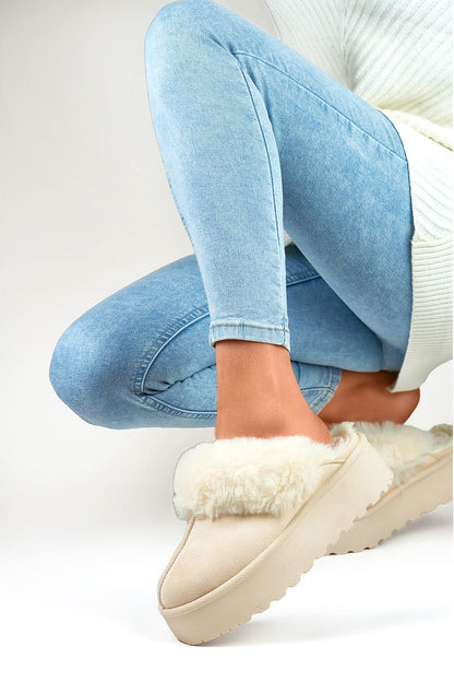 Close-up of stylish PRIMO eco-suede women's slippers featuring a plush fur lining and durable rubber platform for ultimate relaxation.