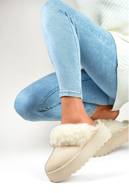 Close-up of stylish PRIMO eco-suede women's slippers featuring a plush fur lining and durable rubber platform for ultimate relaxation.