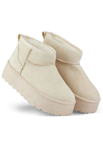 Elegant PRIMO women's snow boots, showcasing premium organic suede leather and a warm fur-lining for ultimate comfort in cold climates.
