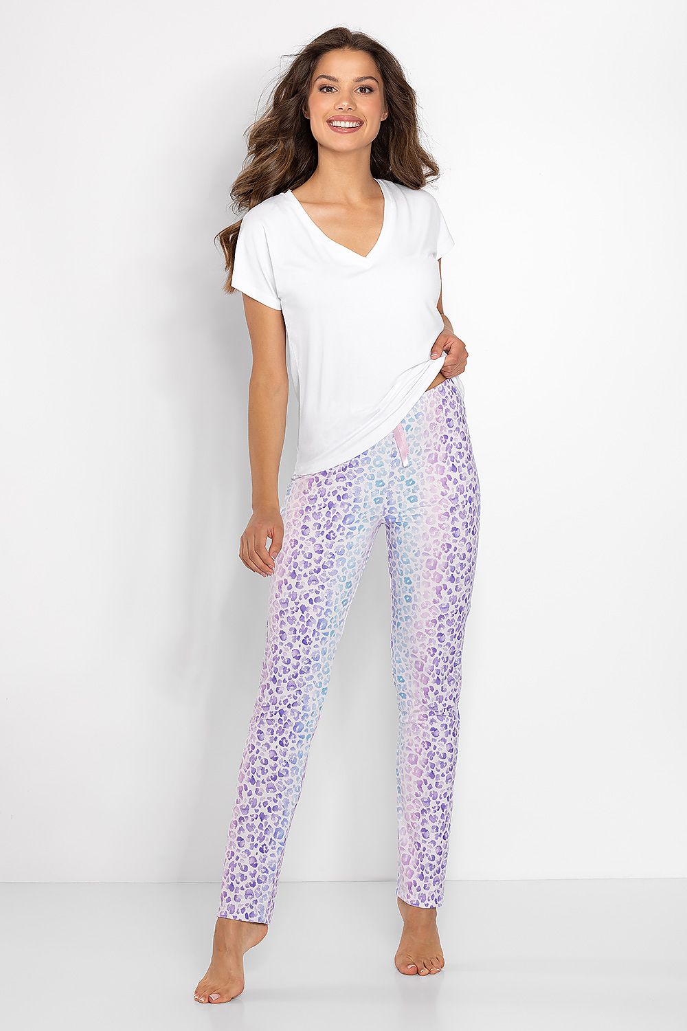 Luxury women's pyjamas set by Momenti Per Me featuring a heart neckline blouse and elegant printed pants, ideal for stylish comfort during sleep.