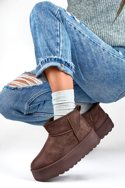 Luxurious women's snow boots by PRIMO featuring eco leather and fur insulation, perfect for cold winter days.