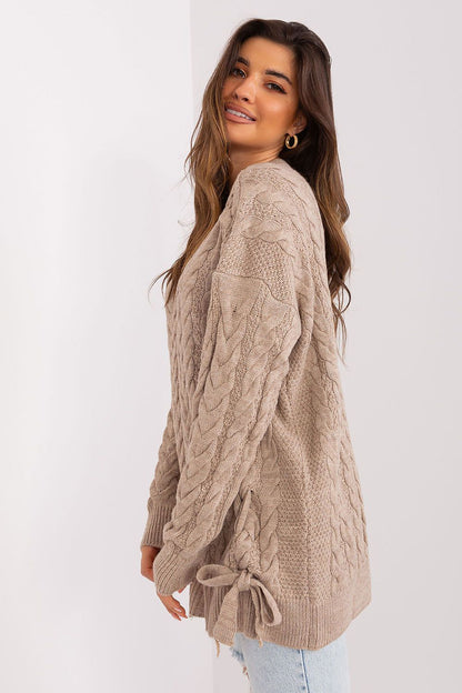 Elegant long sleeve sweater by Badu, highlighting unique decorative ties and crafted from premium acrylic wool.