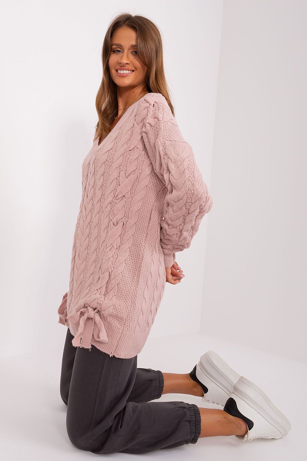 Stylish layout of Badu's acrylic wool sweater highlighting its unique design features, ideal for both casual outings and elegant occasions.