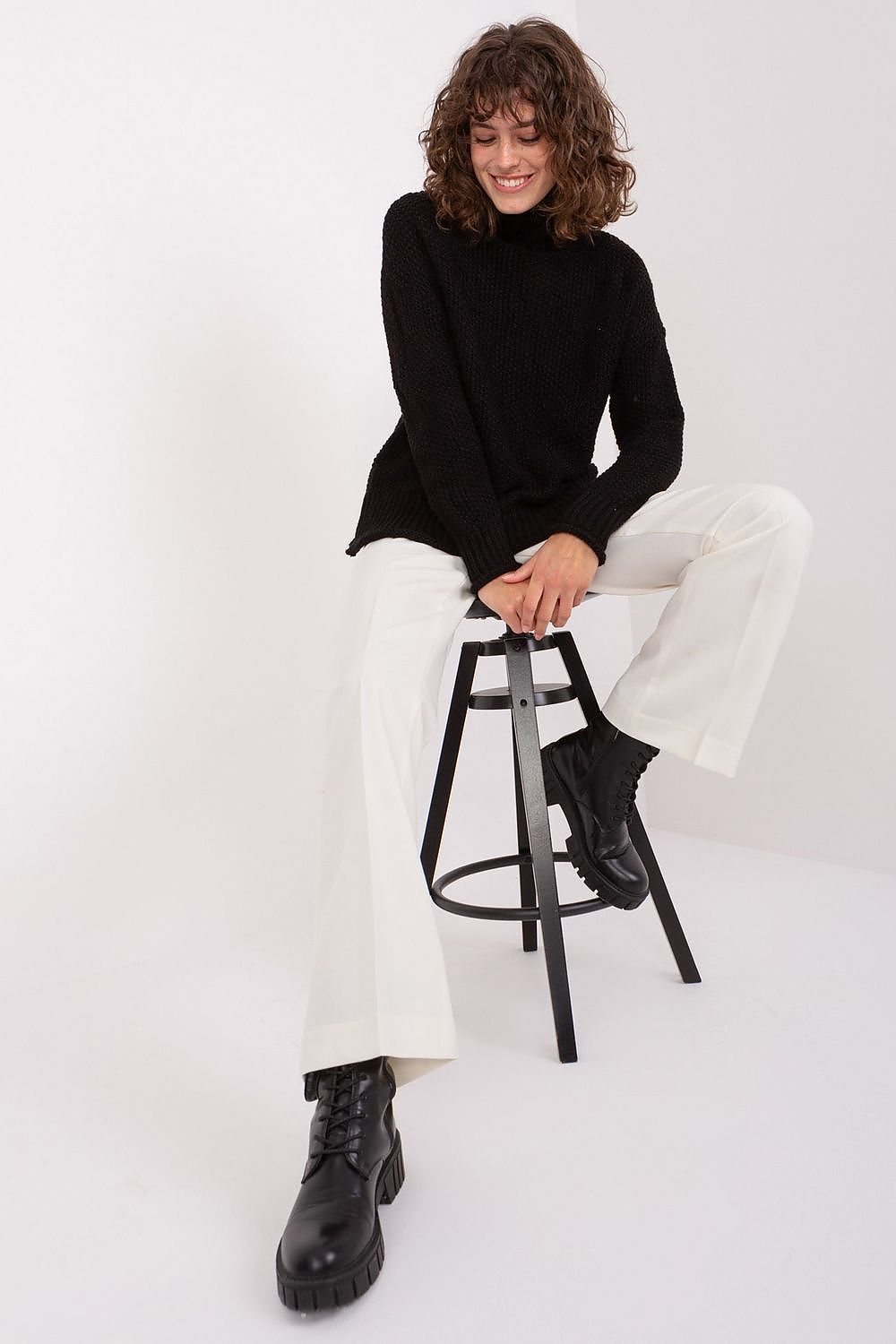 Stylish Women's Turtleneck Sweater by Badu, in a minimalist setting, perfect for casual and professional wear.