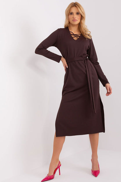 Elegant Lakerta long sleeve dress featuring a heart neckline, decorative lacing, and a seductive side slit, perfect for sophisticated occasions.