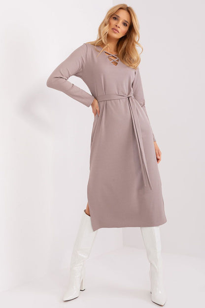 Elegant long sleeve Lakerta dress featuring a heart neckline and seductive side slit, perfect for special occasions.