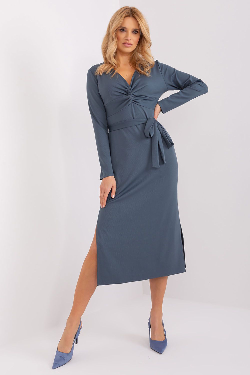Elegant long sleeve daydress by Lakerta featuring a heart neckline, a stylish tie belt, and seductive slits, crafted from luxurious ribbed material for a refined look.