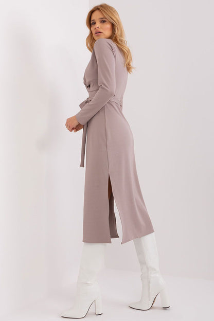 Close-up view of the heart neckline and decorative interlacing on Lakerta's long sleeve daydress.