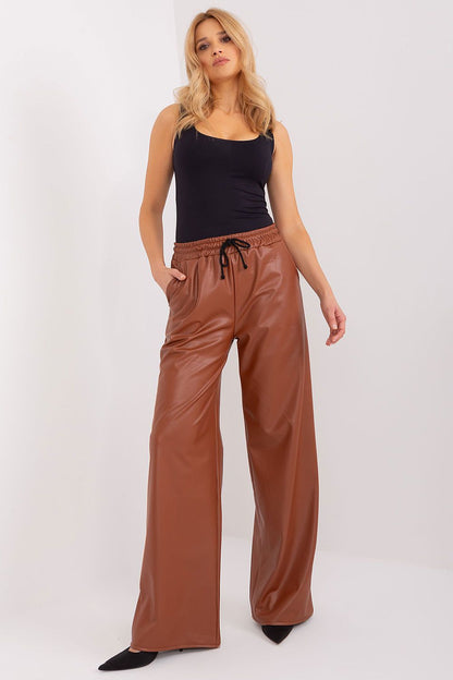 Stylish high-waisted ecological leather trousers by Lakerta, featuring insulation and convenient slip pockets; perfect for chic, eco-friendly fashion.