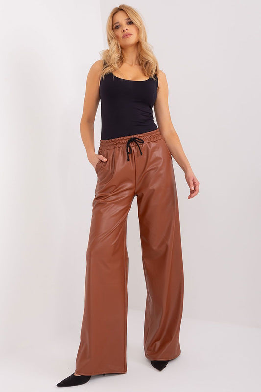 Stylish high-waisted ecological leather trousers by Lakerta, featuring insulation and convenient slip pockets; perfect for chic, eco-friendly fashion.
