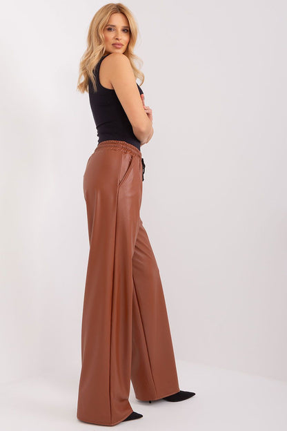Luxurious view of Lakerta's ecological leather trousers with high waist and binding, designed for comfort and style.