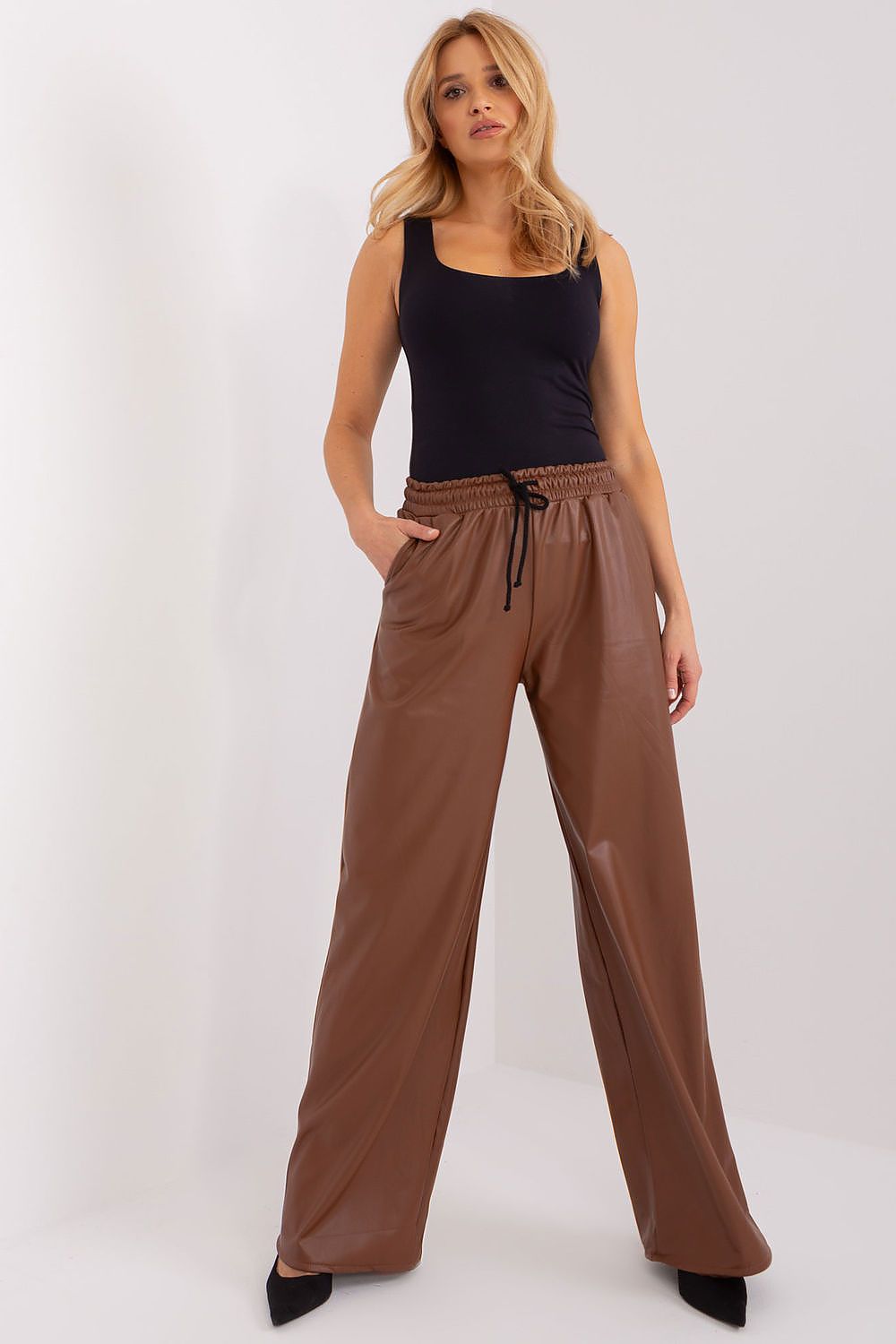 Fashion-forward high-waisted trousers in ecological leather by Lakerta, designed for versatile occasions with insulation.