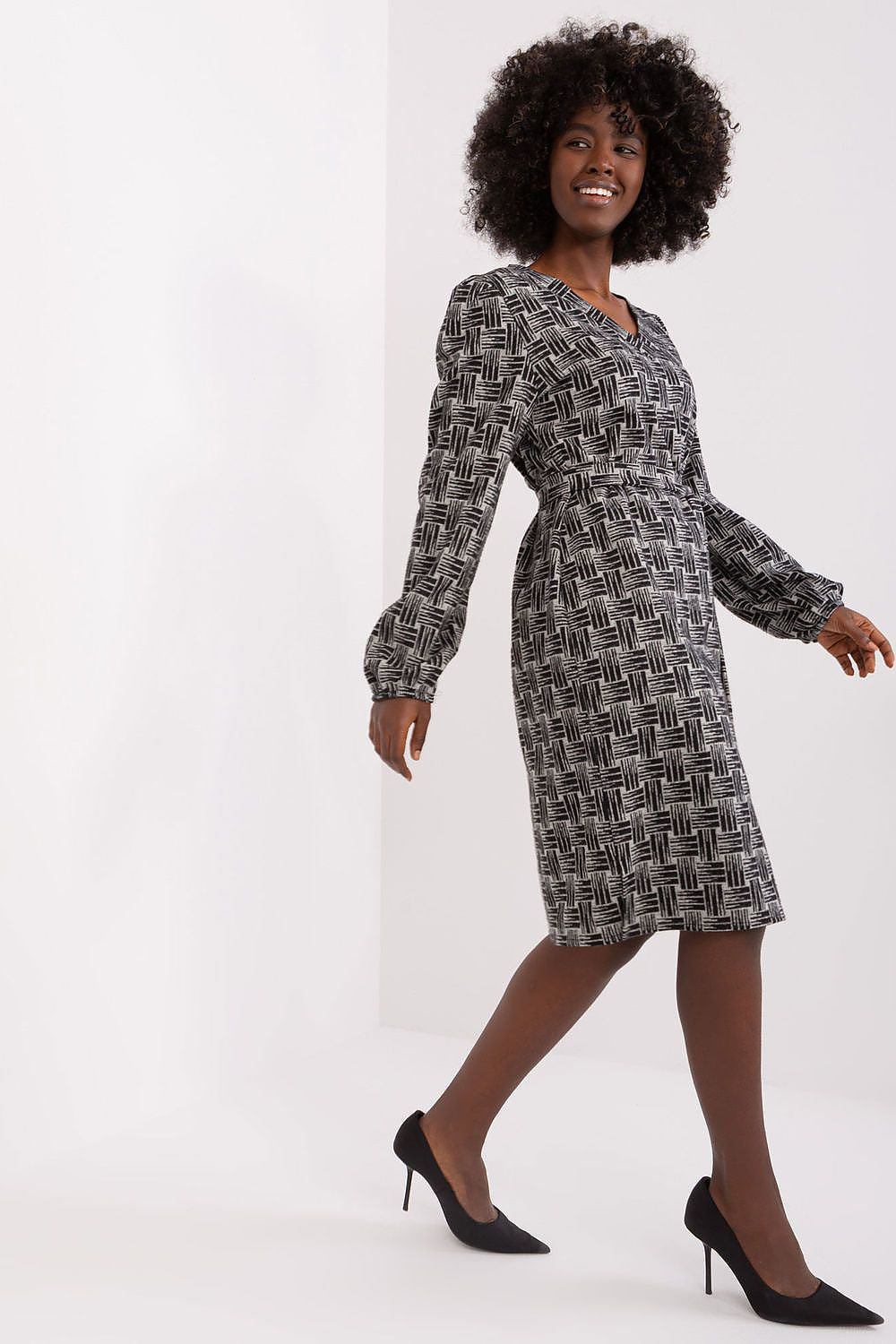 Elegant Lakerta daydress featuring a geometric pattern, a heart neckline, and a flattering tie belt, perfect for sophisticated occasions.