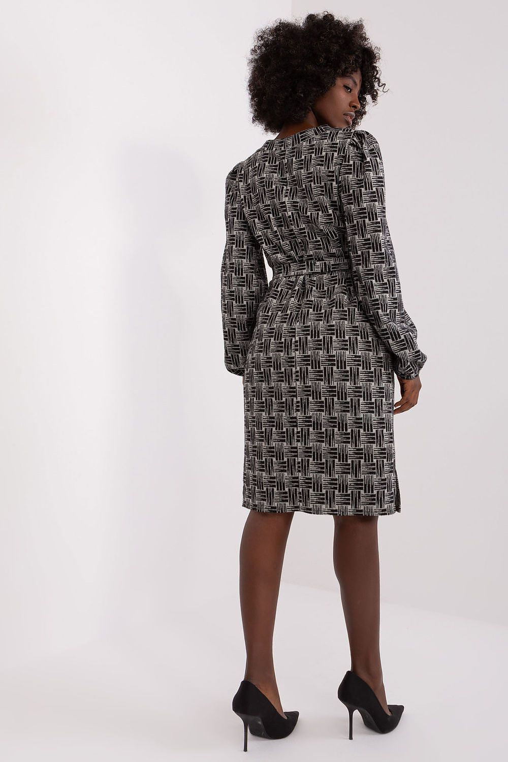 Elegant Lakerta geometric pattern daydress featuring a heart neckline and tie belt, designed for sophistication and style.