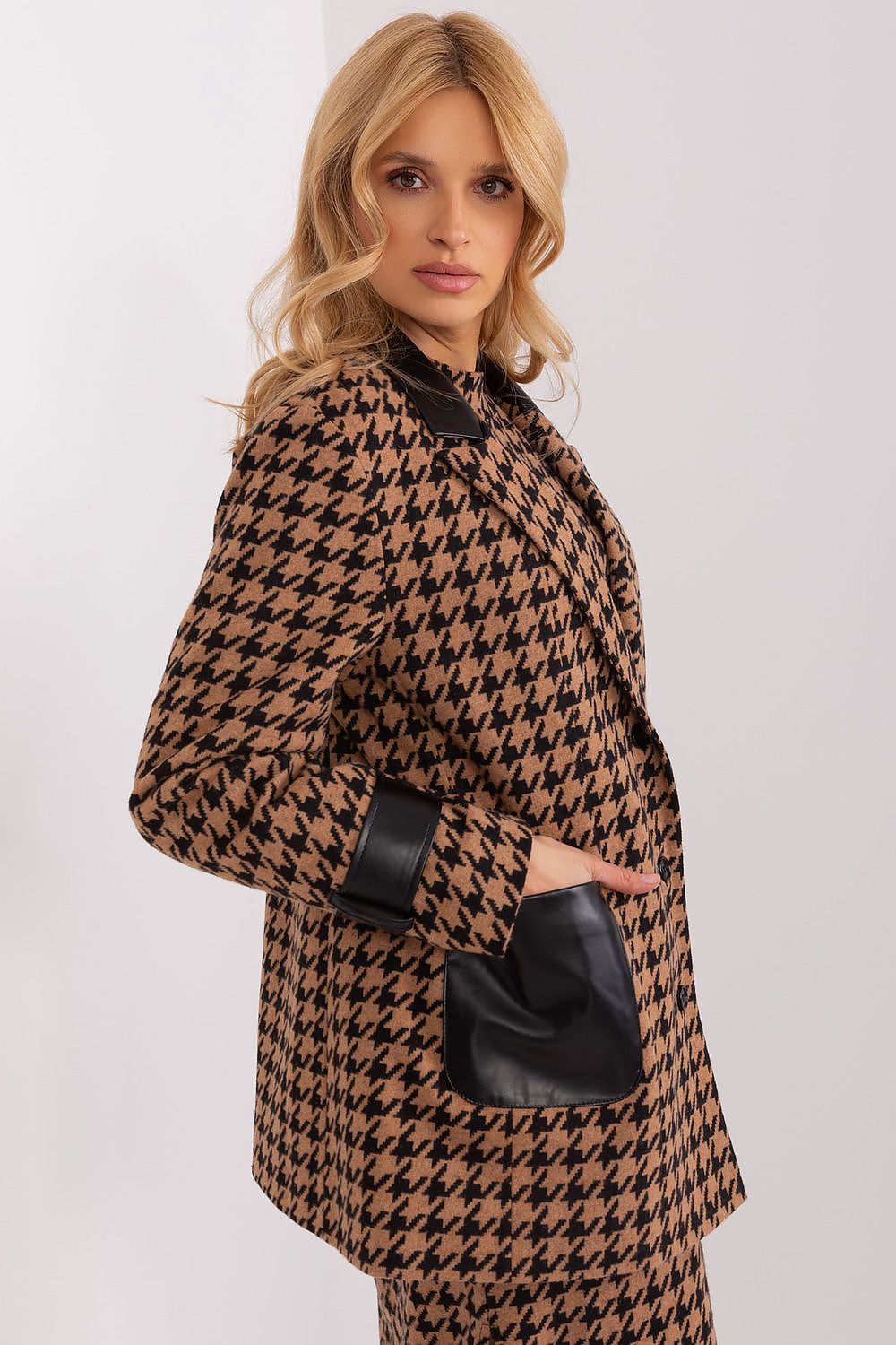 Close-up of the luxurious eco leather trim on the Lakerta Women's Jacket, combining sustainability with chic fashion.