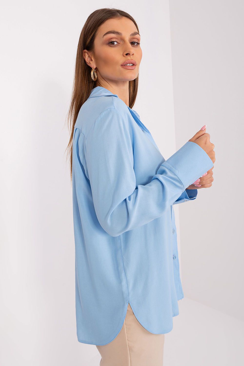 Stylish detail of Lakerta's Luxury Women's Long Sleeve Buttoned Shirt, showcasing the button closure and semi-circular hem.
