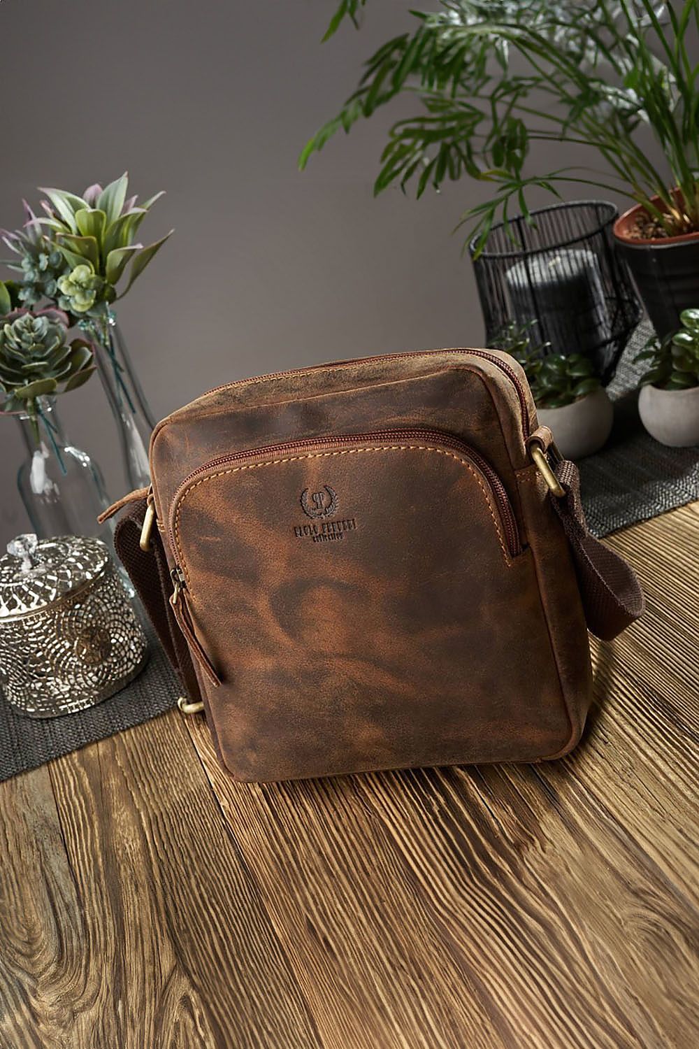 Stylish interior view of Galanter's brown leather shoulder bag T-63-HBR featuring a zippered pocket and slip for phone.