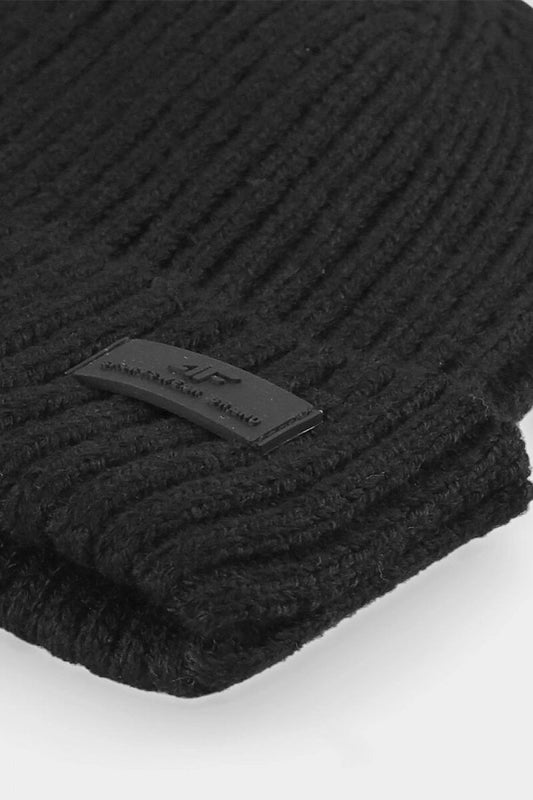 Close-up of a luxurious black ribbed men's cap by 4F, showcasing the premium fabric and branded patch detail.