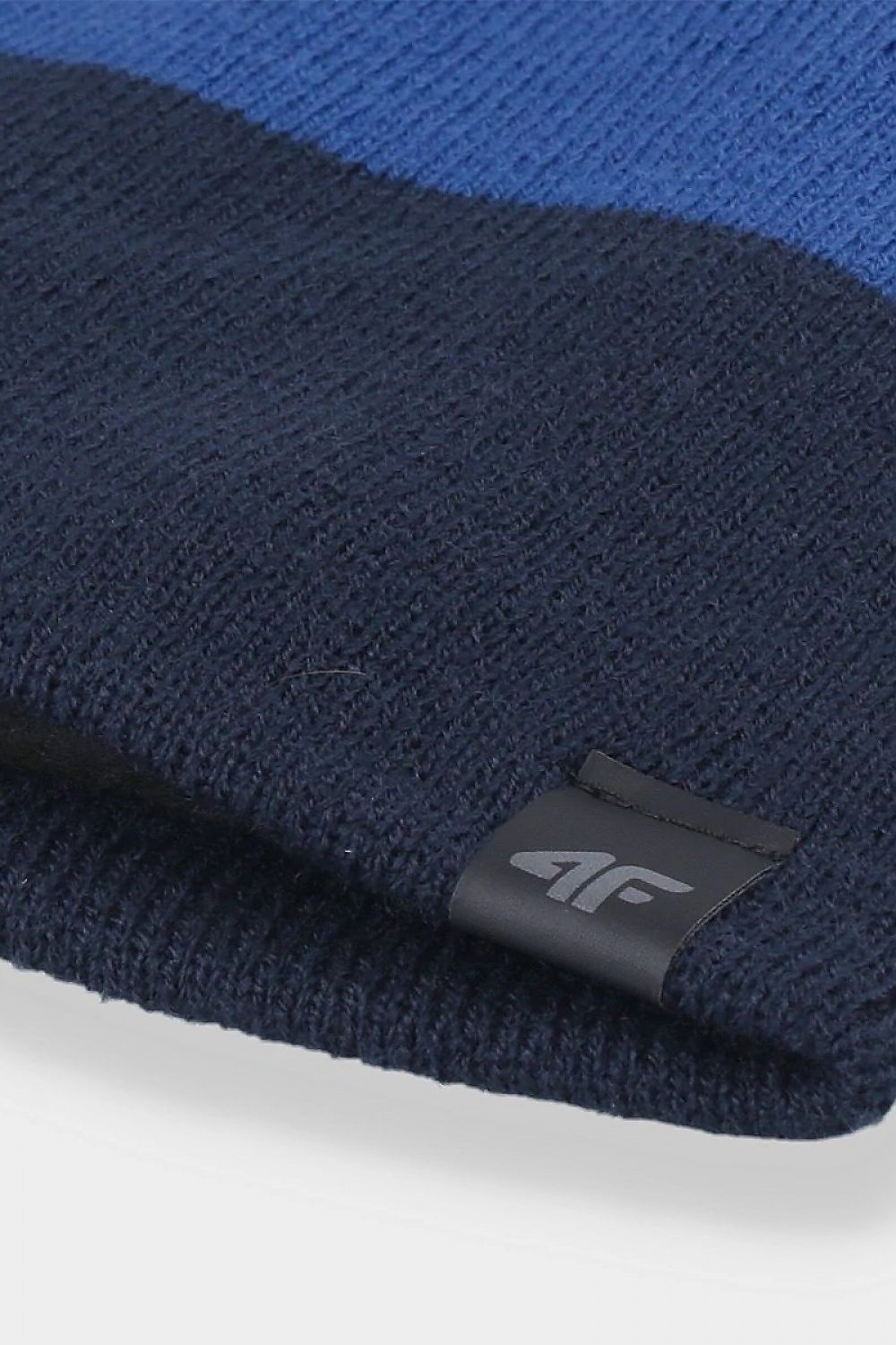 Close-up view of the 4F men's beanie cap showcasing the luxurious texture and branding, designed for comfort and style in colder climates.