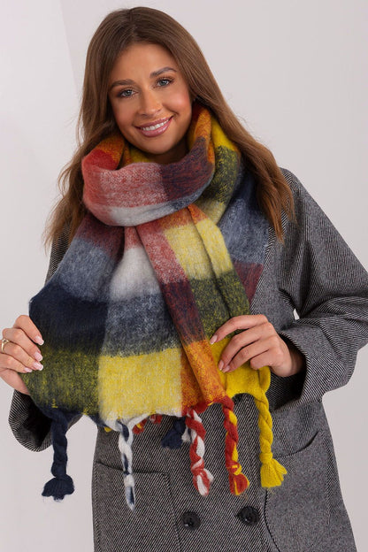 Elegant long plaid scarf featuring vibrant colours and tassels, designed by AT, perfect for chic layering in colder seasons.