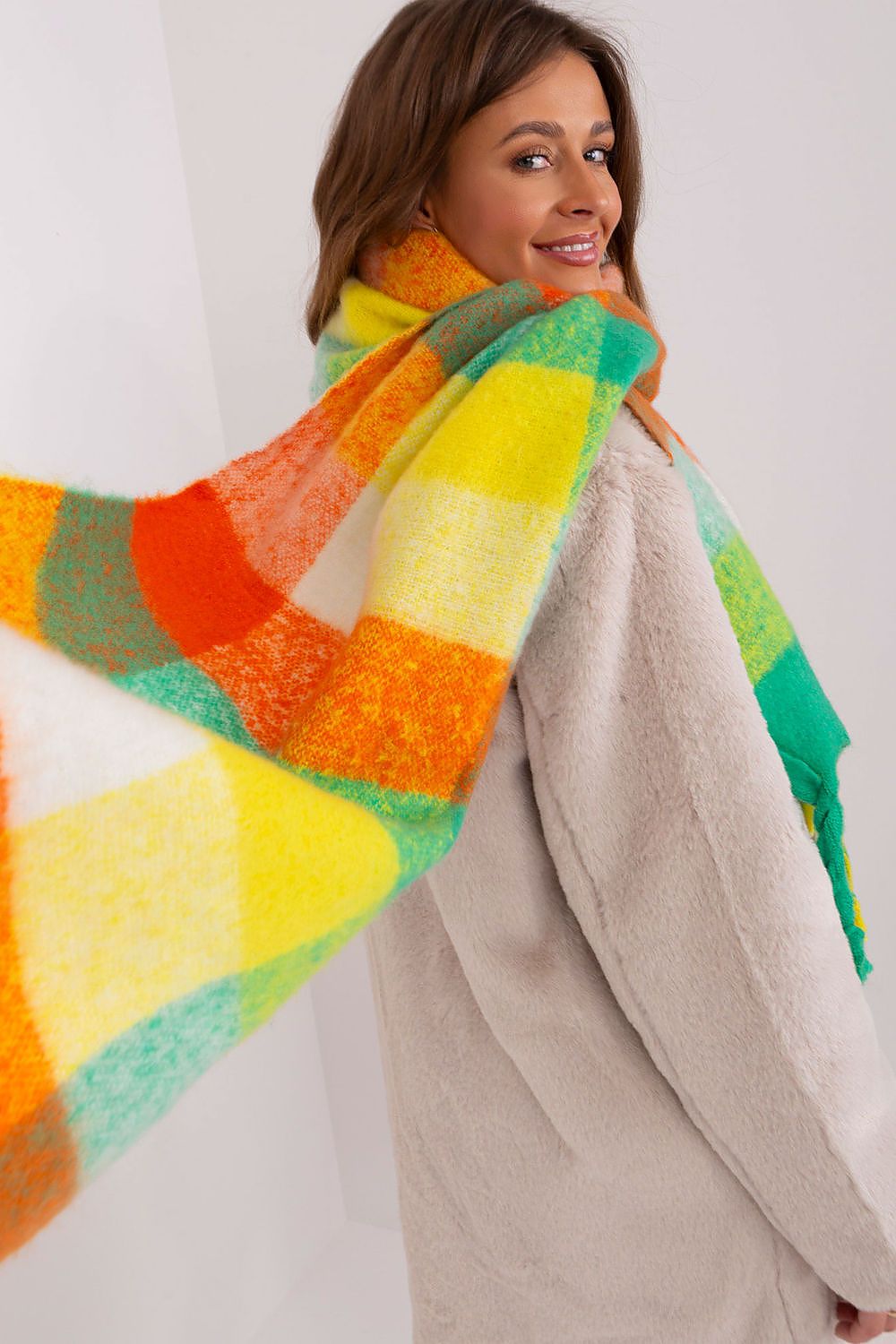 Elegant long scarf featuring vibrant plaid patterns and soft tassels, crafted by AT for a chic autumn and winter look.