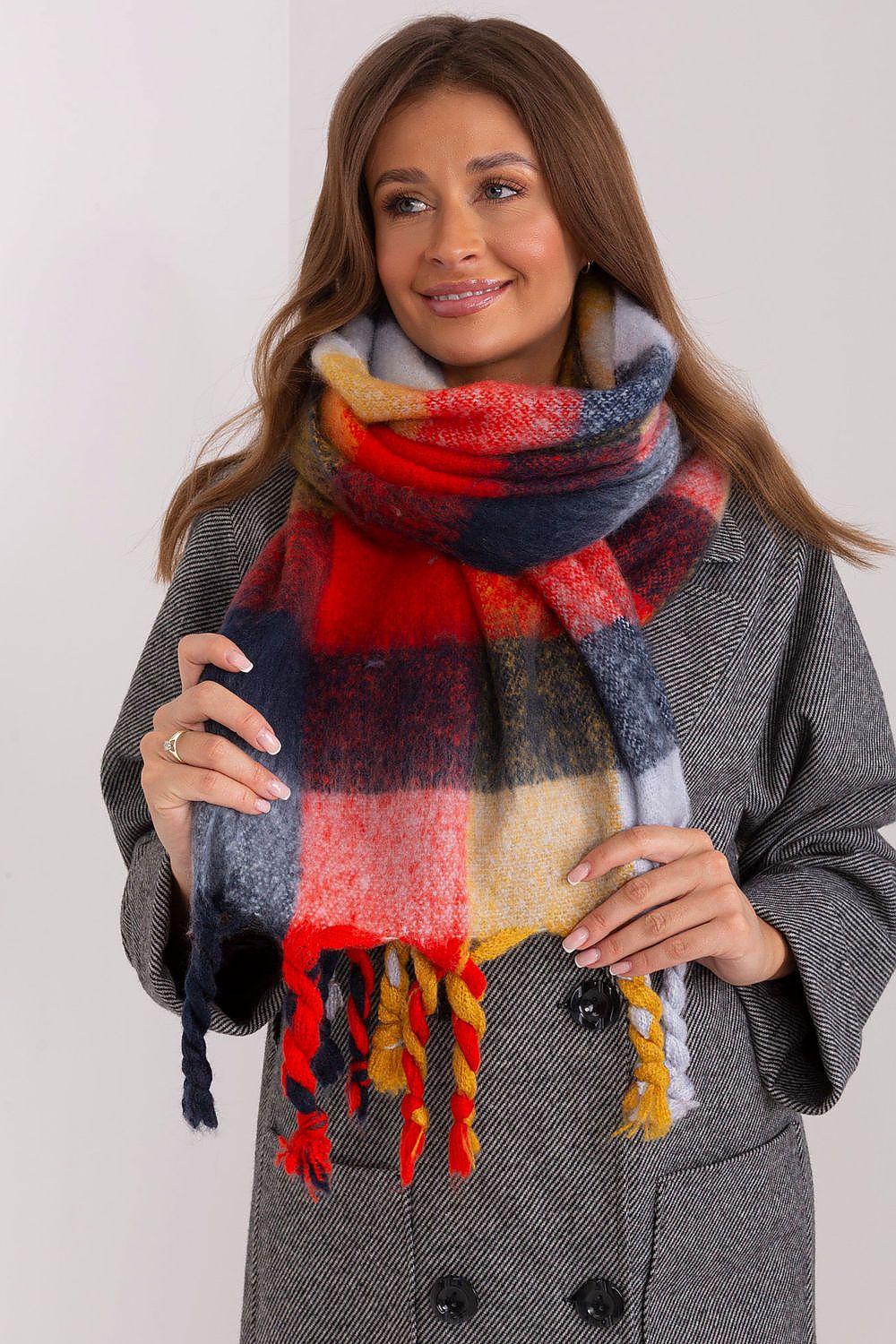 AT's stylish plaid long scarf made of 100% polyester, ideal for adding warmth and sophistication to winter outfits.