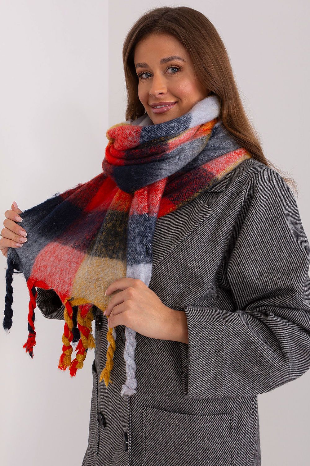 Beautiful long plaid scarf with delicate tassels by AT, designed for a fashionable and cozy fall and winter experience.