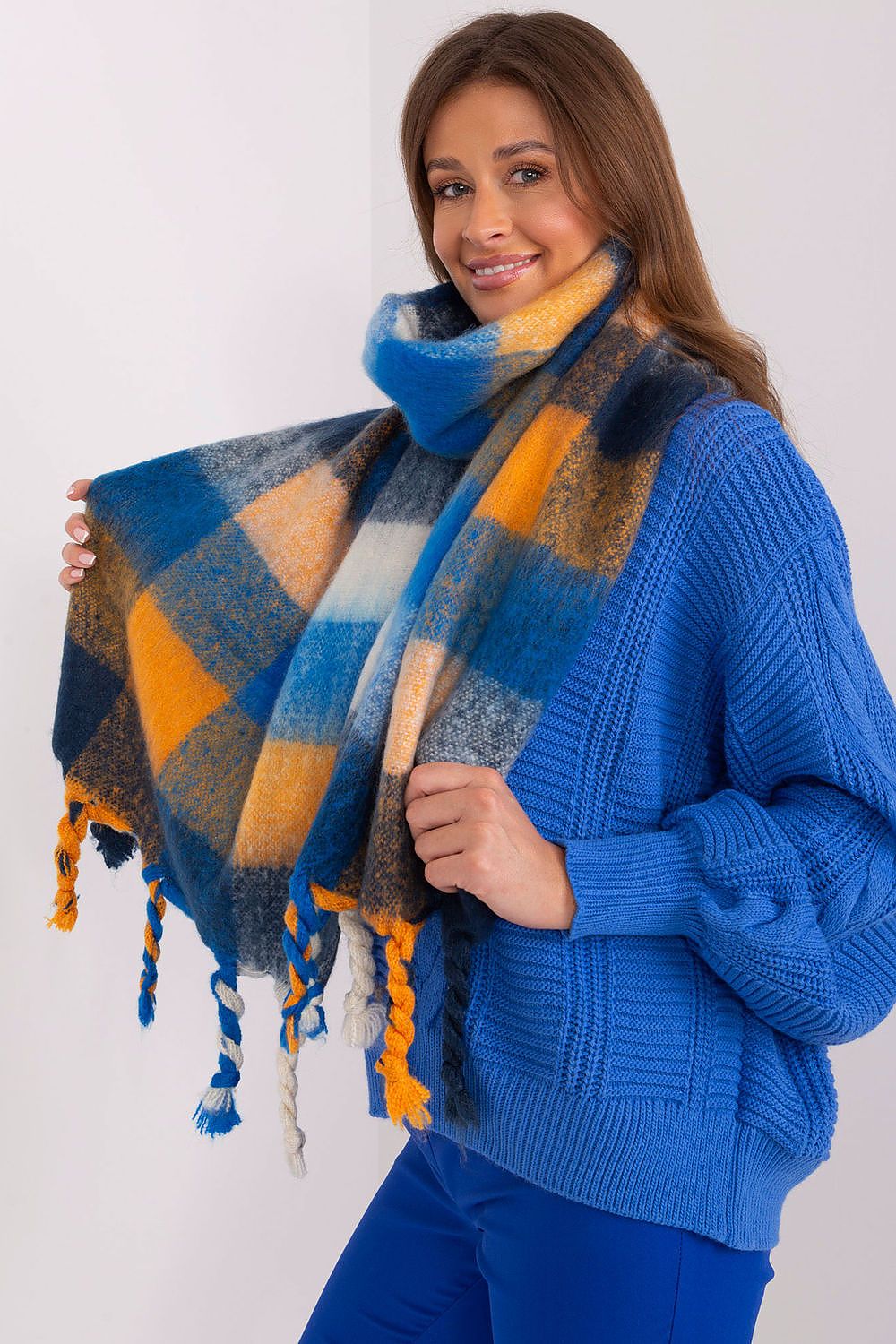 AT's exquisite long scarf featuring a vibrant plaid pattern, made of premium polyester for warmth and comfort during the cooler months.