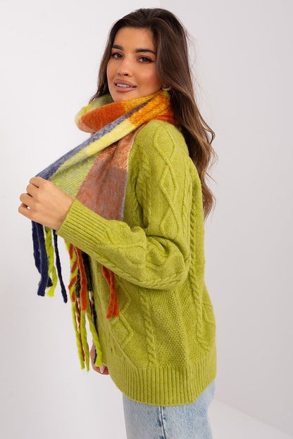 AT Elegant long plaid scarf featuring playful tassels, a chic accessory for autumn and winter wardrobes.
