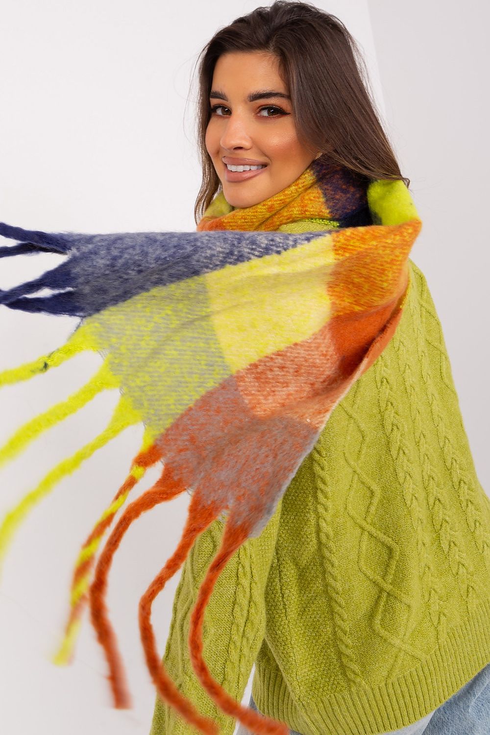 AT Fashionable plaid scarf with tassels, a versatile piece for elevating your winter outfits.