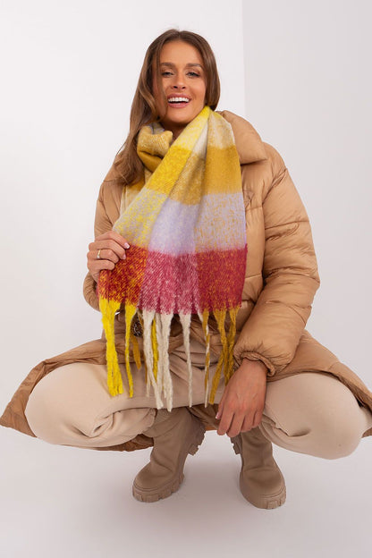 Chic long plaid scarf with elegant tassels, crafted from high-quality polyester by AT, ideal for adding warmth and style.