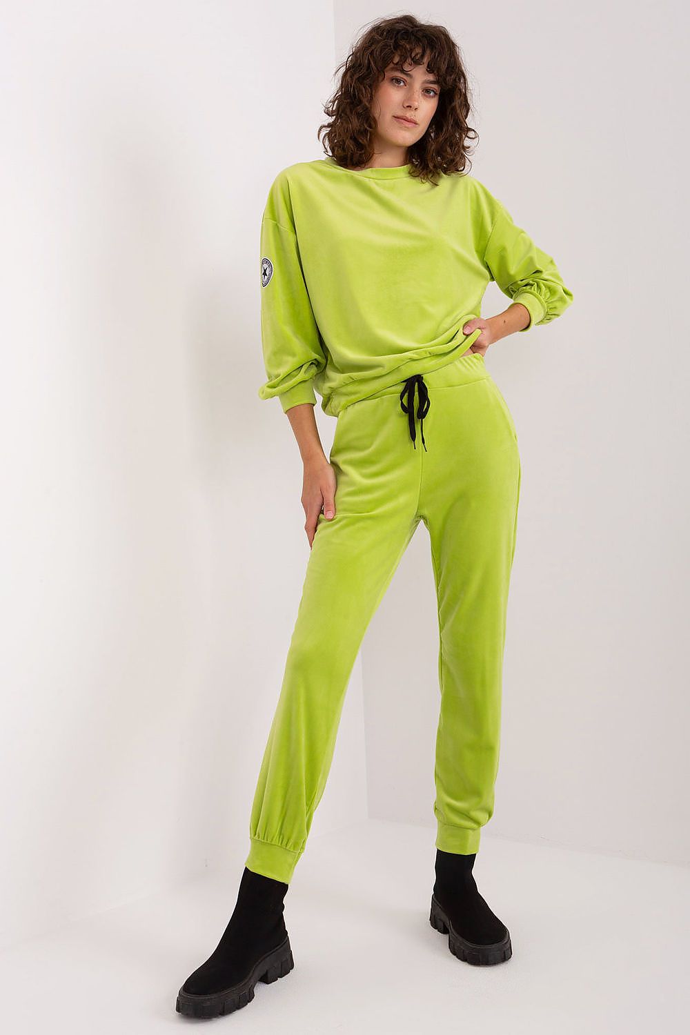 Tapered Velvet Pants with drawstring hem from Italy Moda, designed with practical side pockets for a luxurious athleisure look.