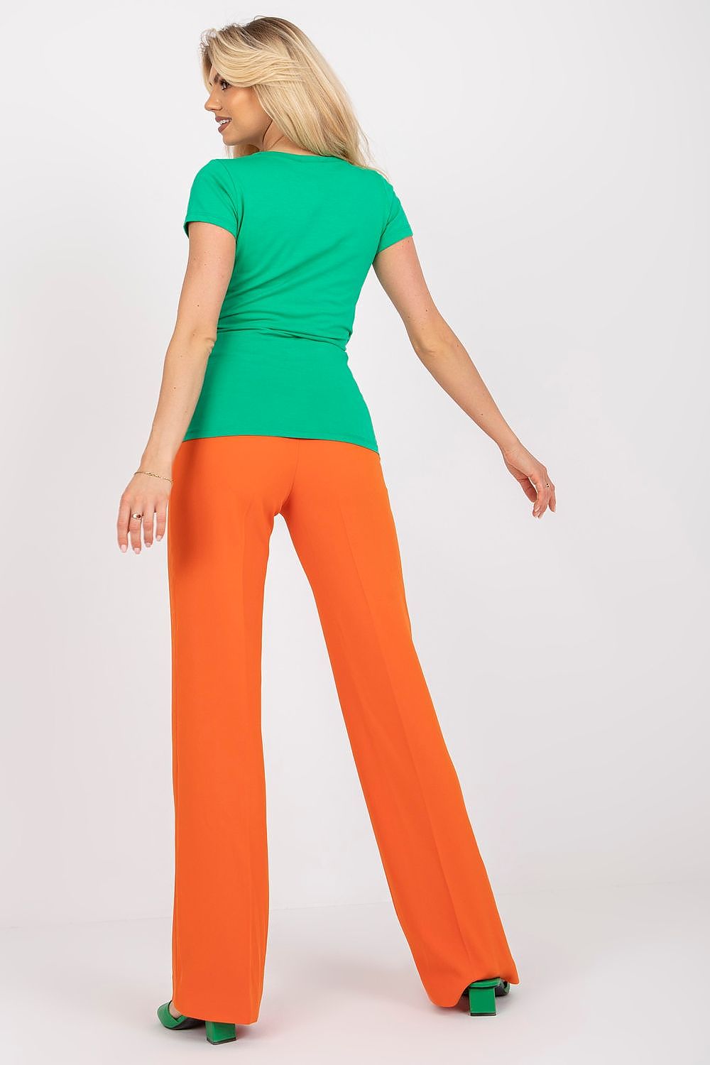 Model wearing Rue Paris elegant fitted blouse, highlighting the flattering cut and soft cotton blend material.