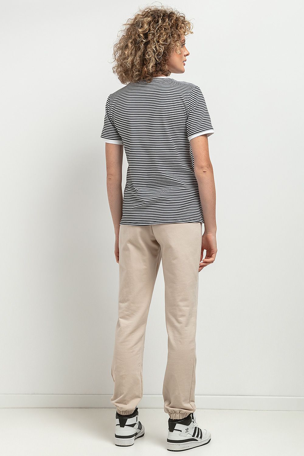 Detailed view of sleeves and neckline of the Slim-Fit V Neckline Blouse by Tessita, emphasising its sophisticated design and craftsmanship.