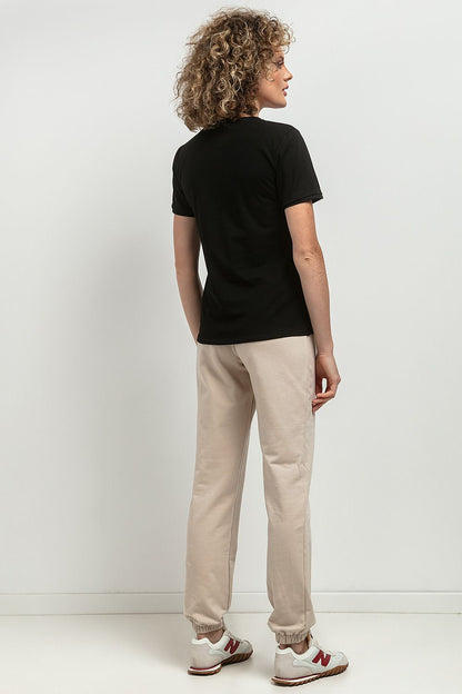 Tessita's sophisticated slim-fit blouse in OEKO-TEX certified cotton knit, featuring a flattering V neckline and refined white pleat detail for elevated elegance.