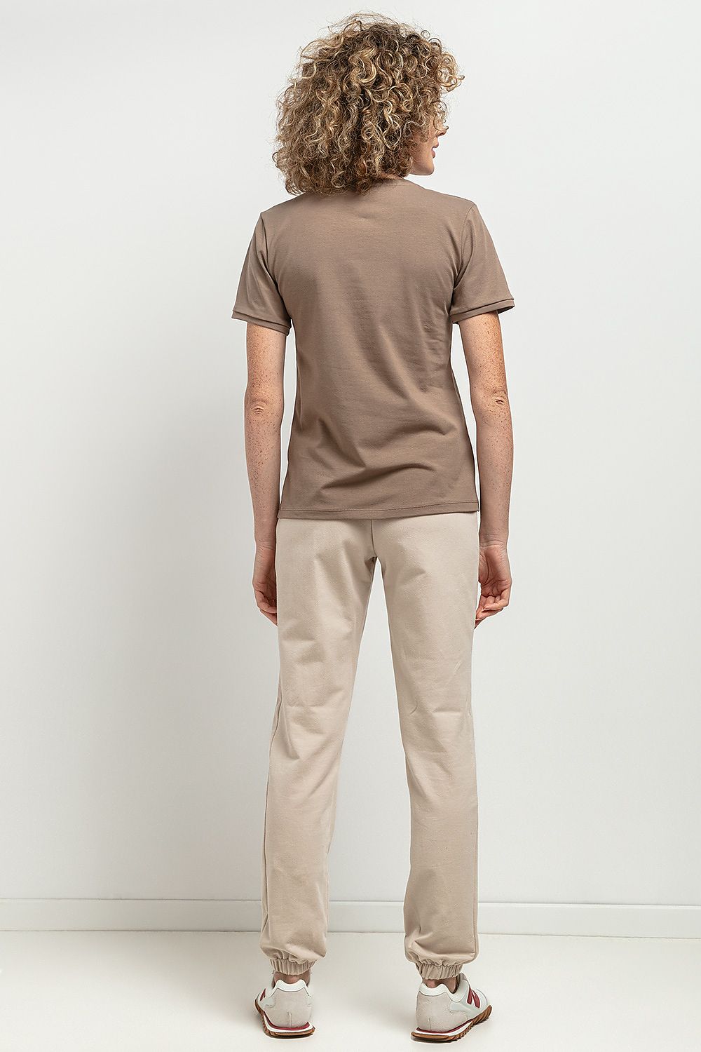 Chic slim-fit V neckline blouse by Tessita in premium OEKO-TEX certified cotton knit, designed with elegant cuffed sleeves and a decorative neckline pleat.