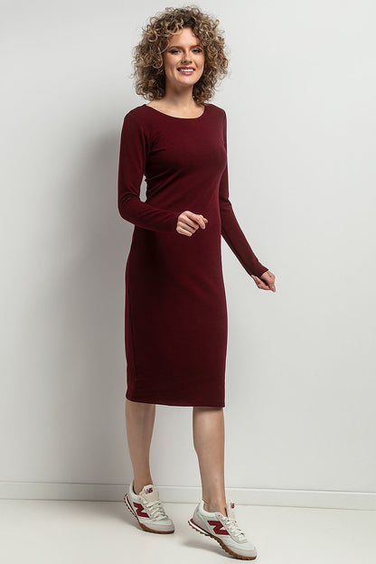 Versatile Tessita fitted midi dress displayed in a minimalist setting, accentuating its style and effortless elegance.