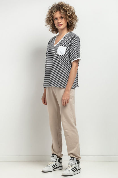 Tessita Loose Blouse, perfect for elegant fashion, designed with a V neckline and decorative pleats for a timeless look.