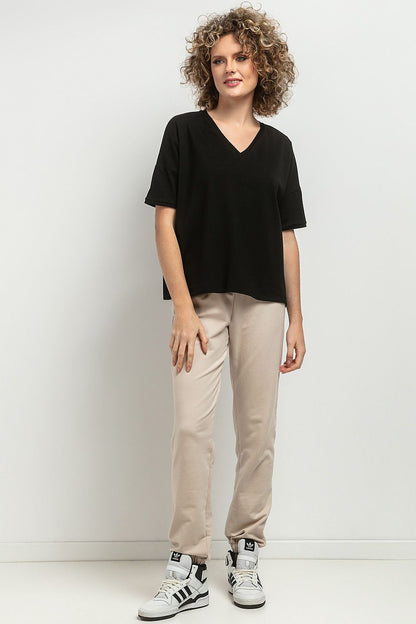 Close-up of the Tessita Loose Blouse showcasing the intricate decorative pleats and soft knitted fabric, emphasizing luxury and quality.