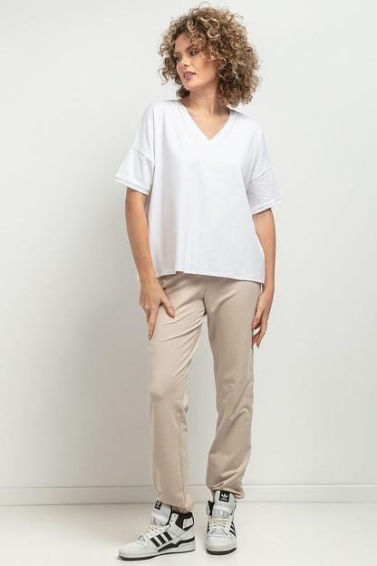 Tessita Luxurious Loose Blouse featuring a feminine V neckline with elegant decorative pleats and an exquisite striped design, crafted from high-quality knitted cotton.