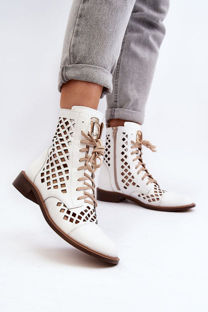 Elegant close-up of Step in style women's natural leather openwork boots, showcasing intricate design details, a secure zipper, and high-quality craftsmanship.
