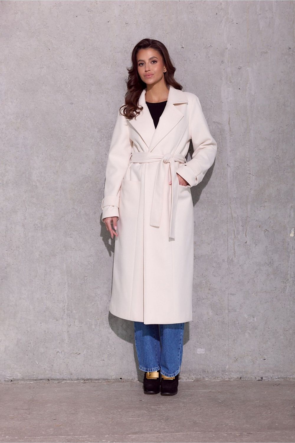 Roco Fashion's Vivienne Midi Insulated Coat, perfect for colder days, designed to complement both sophisticated and sporty outfits.