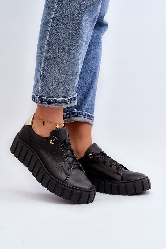 Step in Style elegant women's natural leather half shoes featuring a comfortable insole and thick rubber sole, styled with denim trousers.