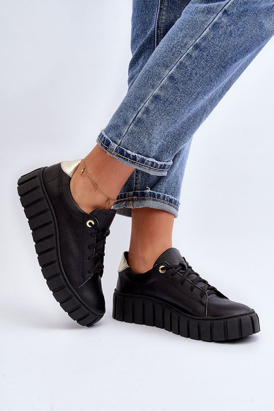 Step in Style luxurious women's natural leather half shoes showcasing a rounded toe and robust rubber sole, elegantly paired with stylish denim.