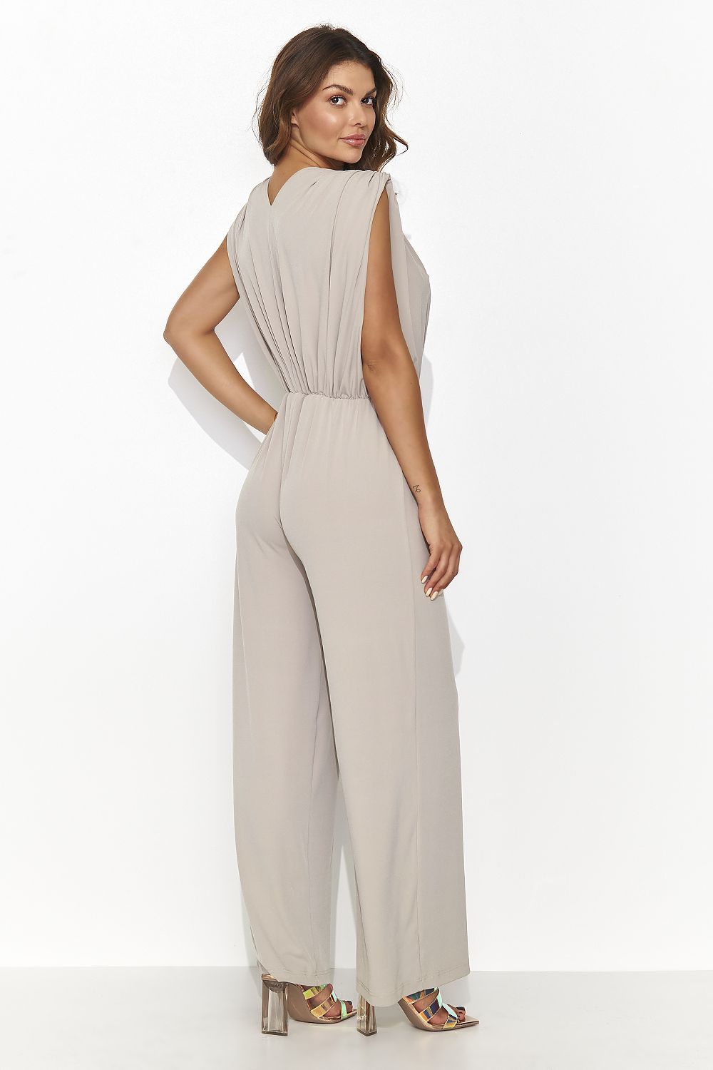 Stylish women's jumpsuit in six timeless colours by Numinou, featuring an elegant heart neckline and wide-leg design for added sophistication.