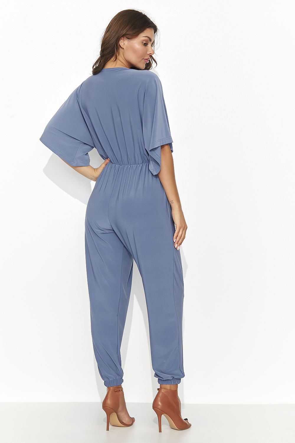 Stylish women's jumpsuit in vibrant red with a heart-shaped neckline, reflecting elegance and charm, designed by Numinou.