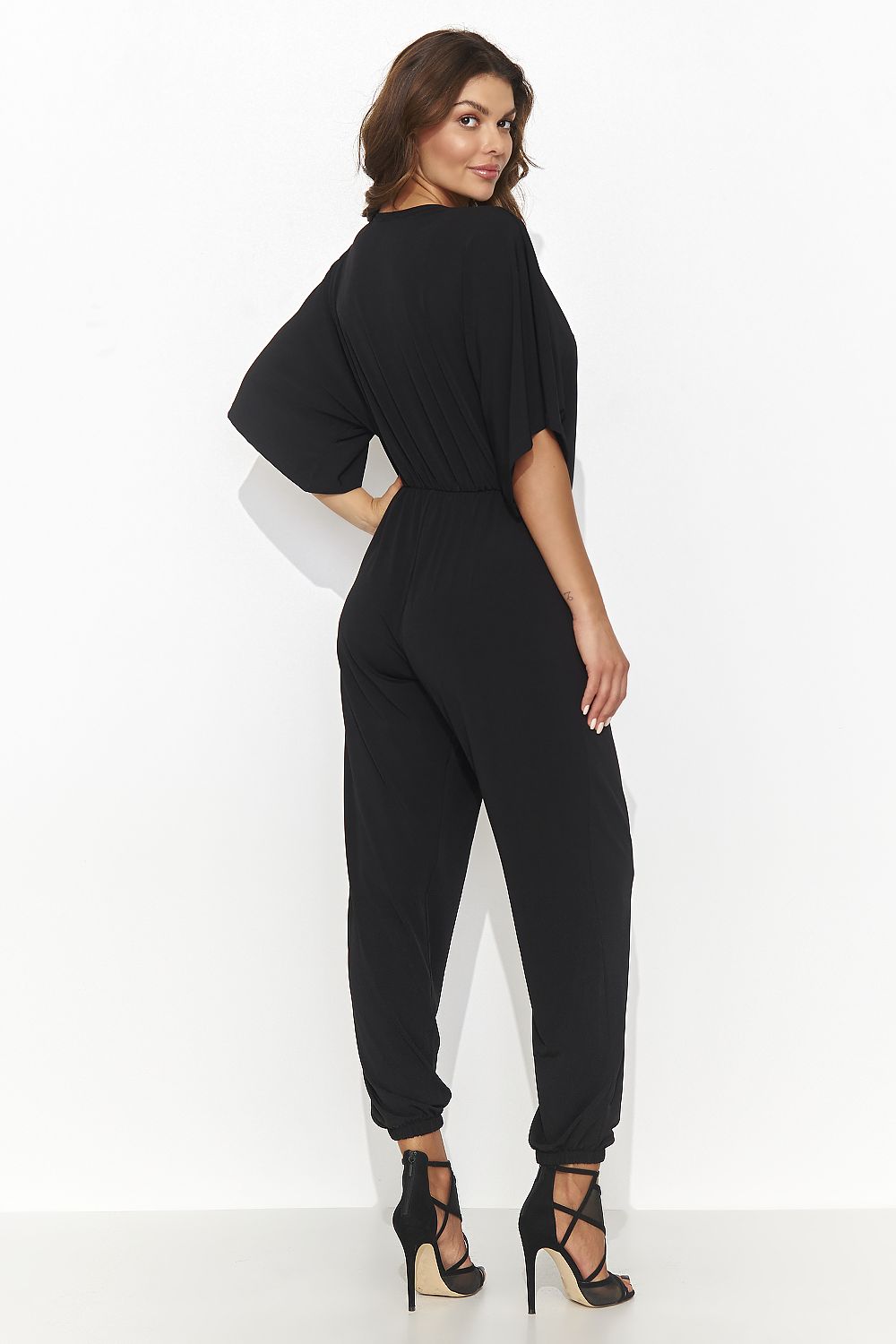 Elegant women's jumpsuit by Numinou featuring a heart-shaped neckline in classic black, designed to enhance the female silhouette and provide sophisticated comfort.